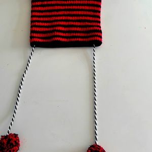 Cat eat hat with Pom poms (used)